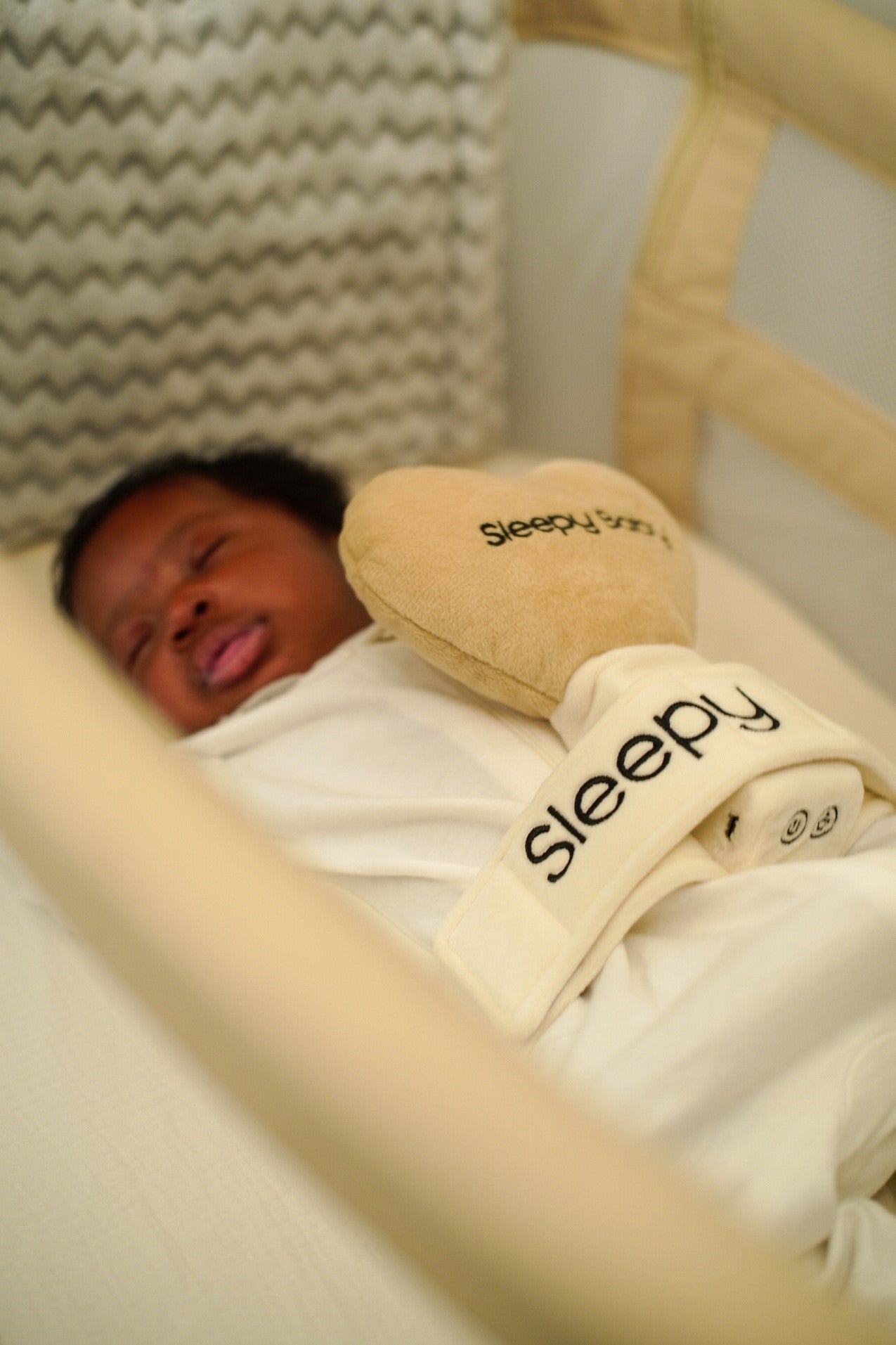 Peaceful baby sleeping in crib with soft pillow and blanket | Sleepy Baby