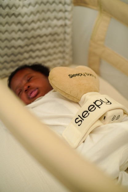 Peaceful baby sleeping in crib with soft pillow and blanket | Sleepy Baby